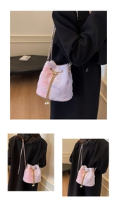 Detail of plush drawstring bucket bag in pink purple gradient with star sequins
