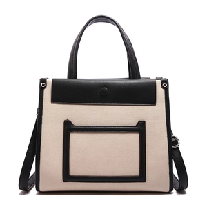Elegant two-tone canvas and black leather tote bag with crossbody strap for work