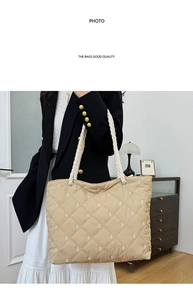 Close-up of quilted beige tote bag featuring white bow prints and sturdy rope handles