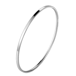 Macro detail of high-polish stainless steel bangle with sleek minimalist buckle design