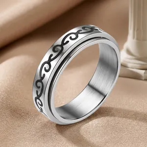 Waterproof stainless steel spinning ring with black scroll patterns and polished finish