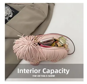 Internal capacity of pink fringe dog shaped crossbody bag with phone and lipstick