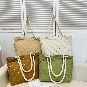 Quilted tote bags with bow patterns and cotton rope handles in four trendy colors