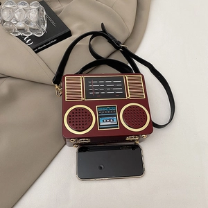 Vintage radio-shaped acrylic crossbody bag in burgundy with adjustable strap and gold details