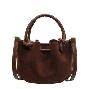 Retro dark brown matte suede bucket bag with knotted leather handle and drawstring closure