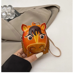 Detailed close-up of horse-shaped leather coin purse with stitching and silver zipper