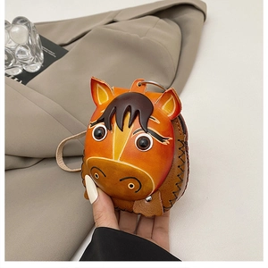 Detail view of handmade horse-shaped leather mini bag with premium stitching and metal ring