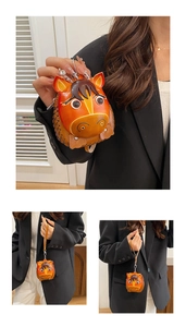 Macro detail of horse-shaped leather mini bag with artisanal stitching and hand strap