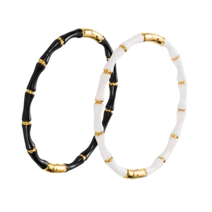Bamboo style white and black enamel bangles with gold-plated stainless steel accents