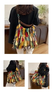 Detail of colorful tassel patchwork on large hobo bag with ethnic fringe design