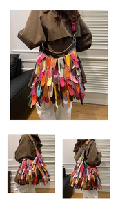 Macro detail of colorful tiered fringe leather on the large capacity shoulder bag