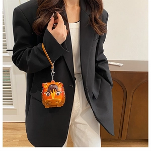 Detailed view of handmade leather horse-shaped coin purse with decorative stitching
