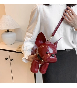 Detail of burgundy French Bulldog puppy crossbody bag with glossy faux leather finish
