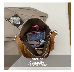 Top-down view of spacious interior storage with a zipper pocket in a brown tote bag