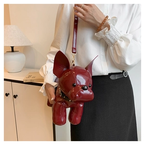 Detail of burgundy glossy PU leather French Bulldog crossbody bag with thin strap