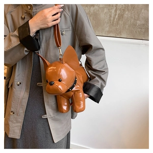 Detail of creative 3D French Bulldog leather crossbody bag with studded collar detail