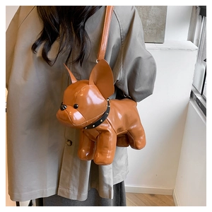 Detail of creative brown faux leather french bulldog crossbody bag with stud collar