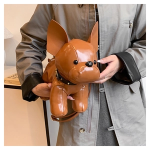Detail of a brown French Bulldog PU leather crossbody bag with a studded collar design