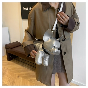 Silver metallic French Bulldog cross-body bag with rivet collar detail on female model