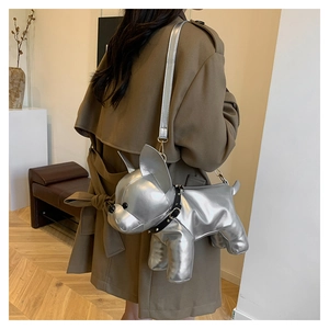 Detailed view of silver French Bulldog shaped crossbody bag with metallic finish