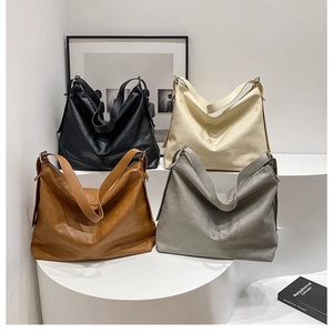 Detailed display of high-capacity faux leather hobo bags in four minimalist colors