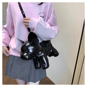 Detail of glossy black French Bulldog crossbody bag with metallic zipper and strap