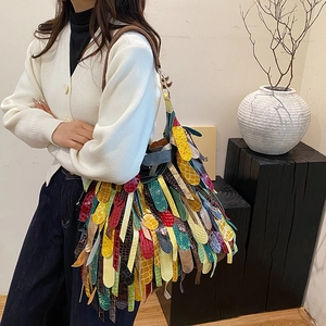 Bohemian oversized shoulder bag with colorful fringe and mixed animal print textures
