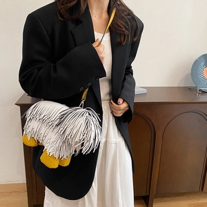 Unique dog-shaped fringe shoulder bag in black and white with creative tassel design