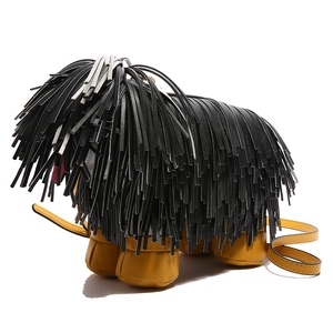 Quirky puppy shaped crossbody bag with black leather tassels and yellow accents