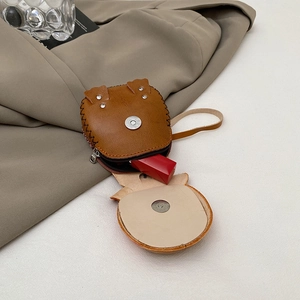 Brown leather animal-shaped mini coin purse with drawstring and interior lipstick storage