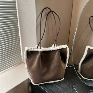 Brown suede tote bag with white faux fur trim and dual slim straps for winter