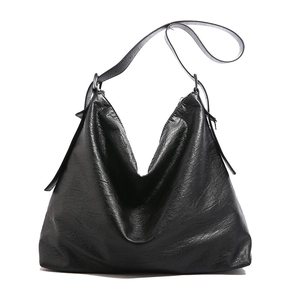 Large black leather hobo bag with natural grain texture for business travel and commuting