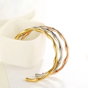 Bamboo-style C-shaped stainless steel open bangles in gold, silver and rose gold finishes