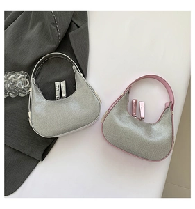 Detail of hobo moon bags in metallic silver and pink contrast with dual zippers