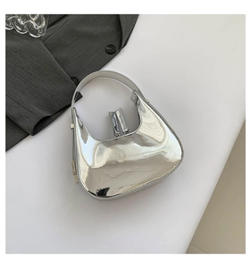 Top view of metallic silver hobo bag with reflective mirror finish on white background
