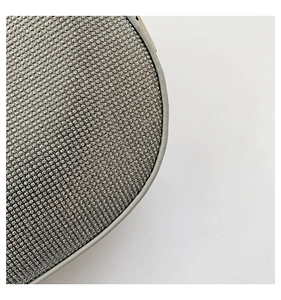 Close-up of sparkling silver rhinestones and smooth metallic edge on a moon bag