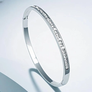 Minimalist silver titanium steel hinged bangle with luxury row of rectangular zircons