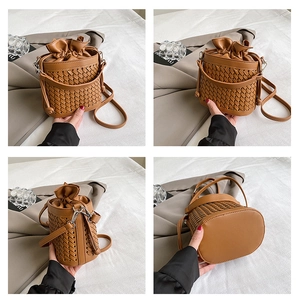 Close-up of brown woven texture and drawstring lining on stylish bucket bag