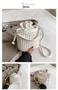 Close-up of white woven bucket bag featuring detailed PU texture and drawstring closure