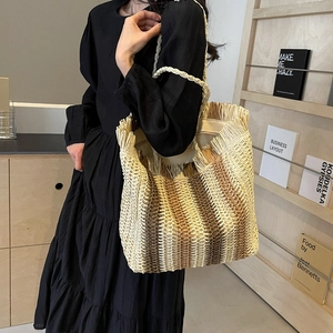 Large woven straw tote bag with gradient design and fringe details for women