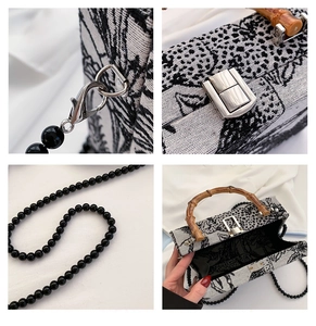 Detail of vintage jacquard fabric with forest pattern and natural bamboo handle