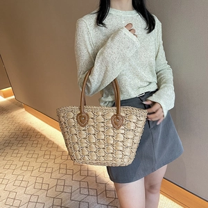 Handmade straw tote bag with brown leather handles and large capacity beach style