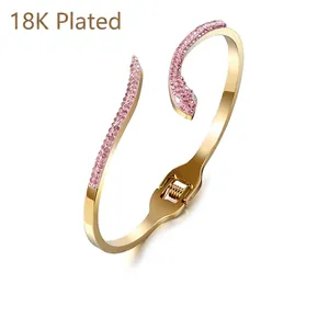 Snake-shaped 18K gold plated stainless steel open bracelet with pink rhinestones