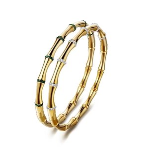 Bamboo style gold plated stainless steel bangles with green gemstone and white crystals