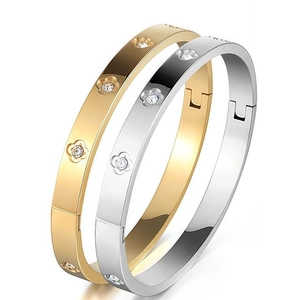Roman numeral open bangle with crystal clover inlay in gold and silver stainless steel
