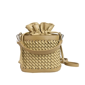 Woven bucket bag in beige with drawstring closure and detachable shoulder strap