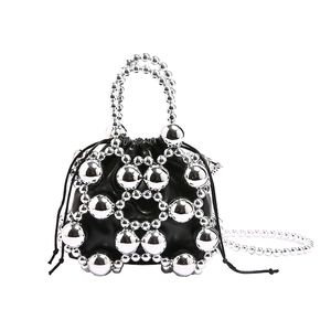 Mini black bucket bag with silver beaded mesh and drawstring closure in 80 chars