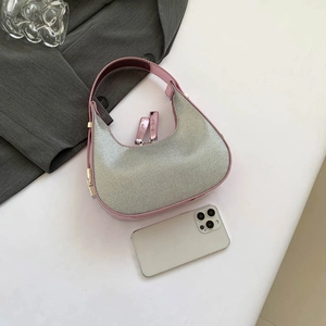 Chic silver rhinestone crescent hobo bag with pink leather trim and dual zip design