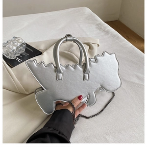 Detail of silver dinosaur handbag with metallic PU leather and chrome chain strap