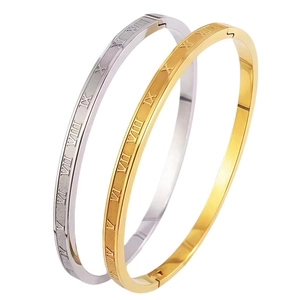 Minimalist Roman numeral bangles in gold and silver finish with brushed metal texture